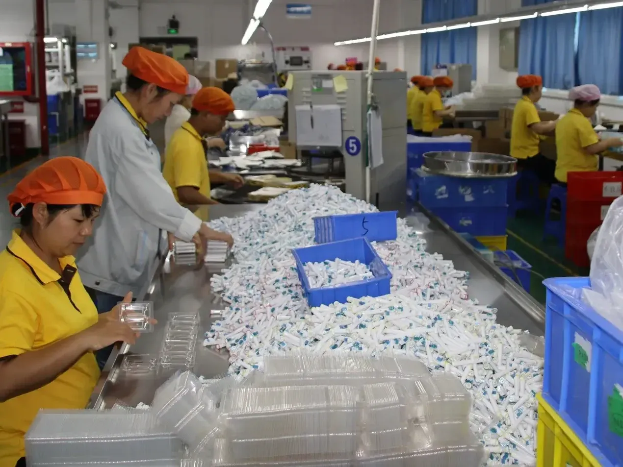 Final inspection of finished electric toothbrush brush heads before packing at AileCare