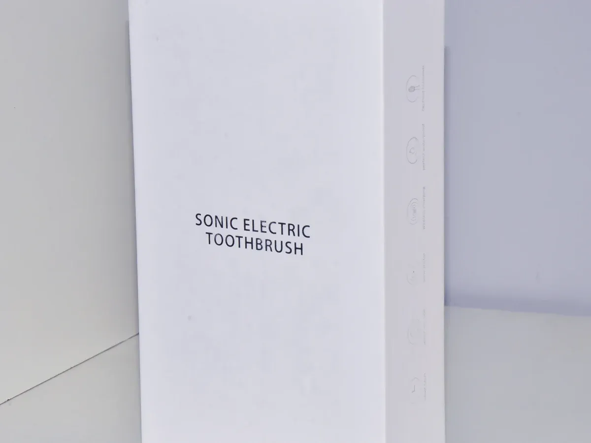 White retail packaging box for a sonic electric toothbrush, reviewed for retail assortment and pack presentation